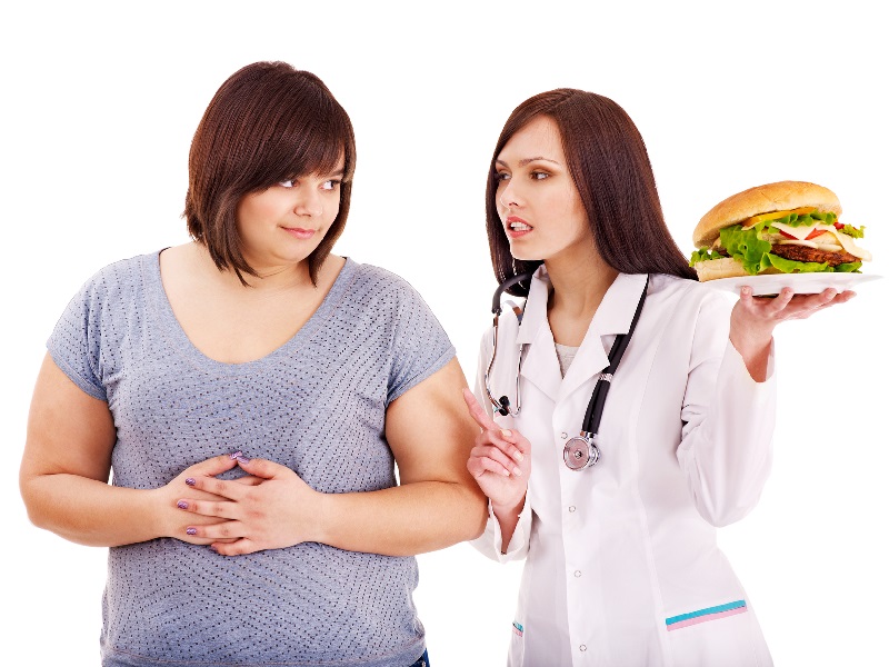 Overweight woman with hamburger and doctor.